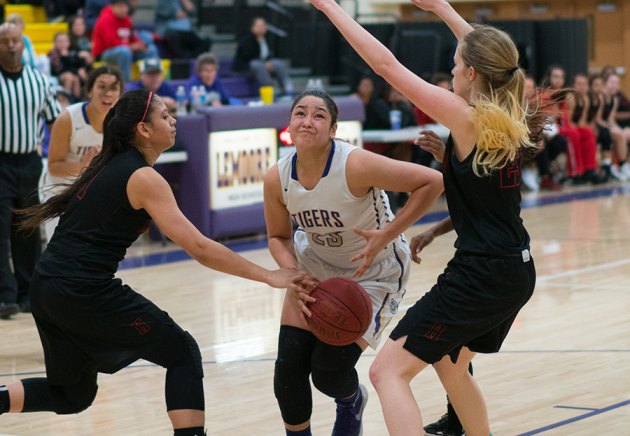 Lemoore's Stephanie Gomez eyes the basket in Tuesday's loss to Hanford in the LHS Event Center.